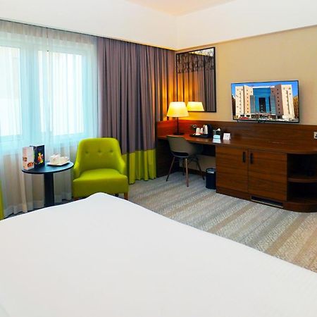 The Grand Lux Hotel Doha Exterior foto A room at the hotel
