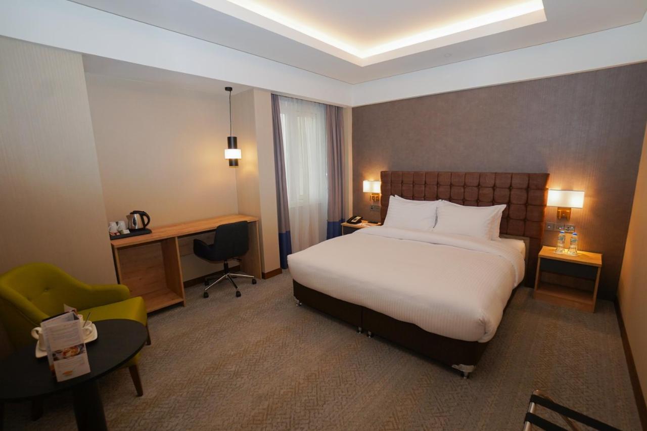 The Grand Lux Hotel Doha Exterior foto A room at the hotel