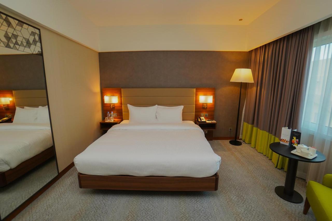 The Grand Lux Hotel Doha Exterior foto A room at the hotel