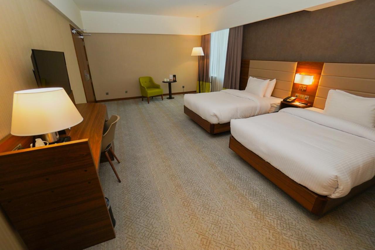 The Grand Lux Hotel Doha Exterior foto A room at the hotel