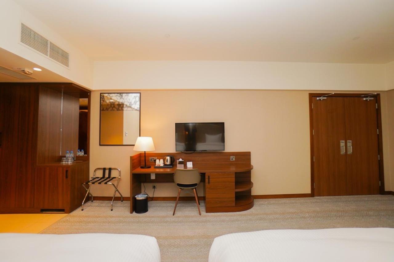 The Grand Lux Hotel Doha Exterior foto A room at the hotel